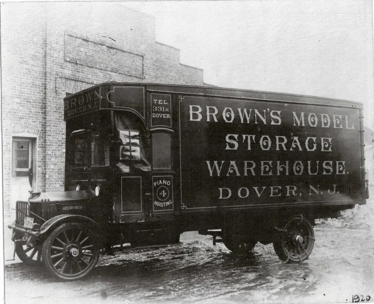 1920 - Solid tires and a chain drive. Still N. Sussex Street.
